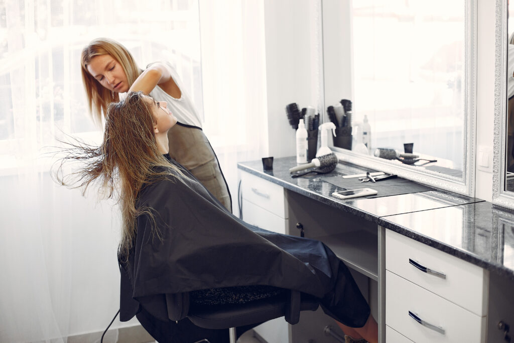 woman drying hair in a hairsalon